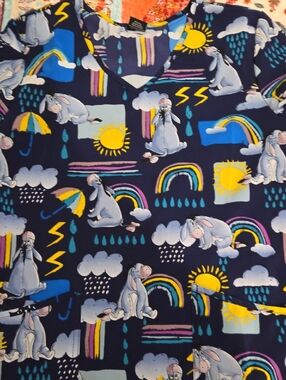 Medium NWOT Eeyore Printed Navy Scrub Top with Rainy Day Motif